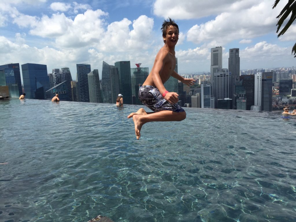 Boy jumping in Marina Bay pool