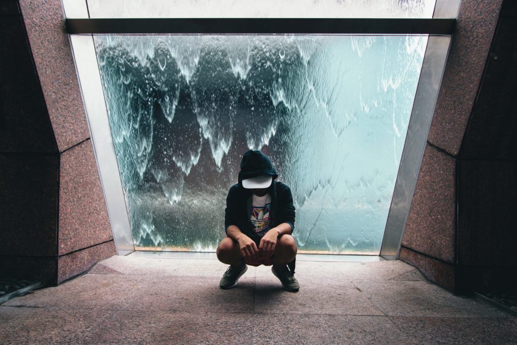 Singaporean guy sitting in front of a window