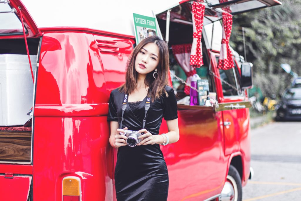 Singaporean woman with red van