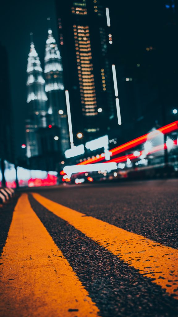 road with the Petronas towers in the background