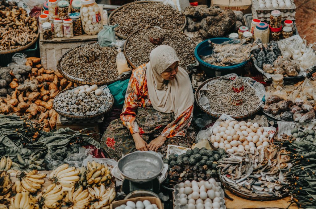 Malaysian Muslim woman selling in a market