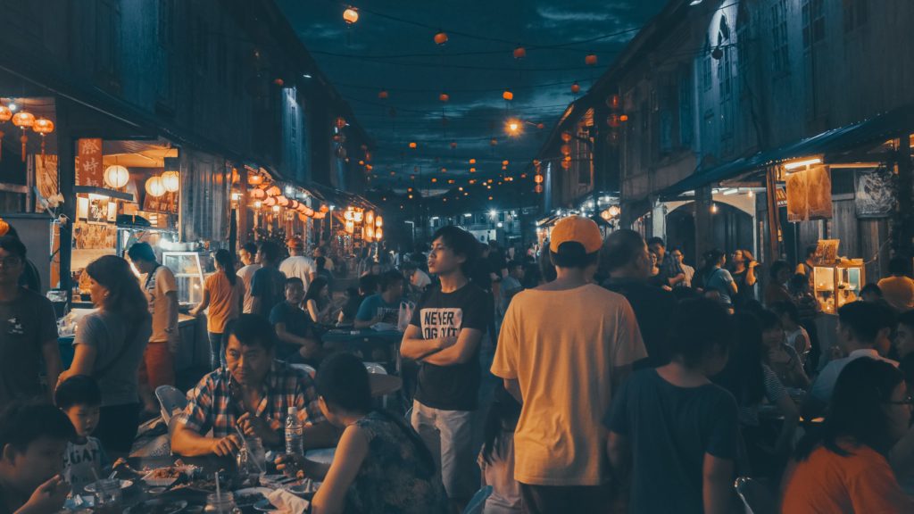 Malaysian at an outdoor market with food stalls
